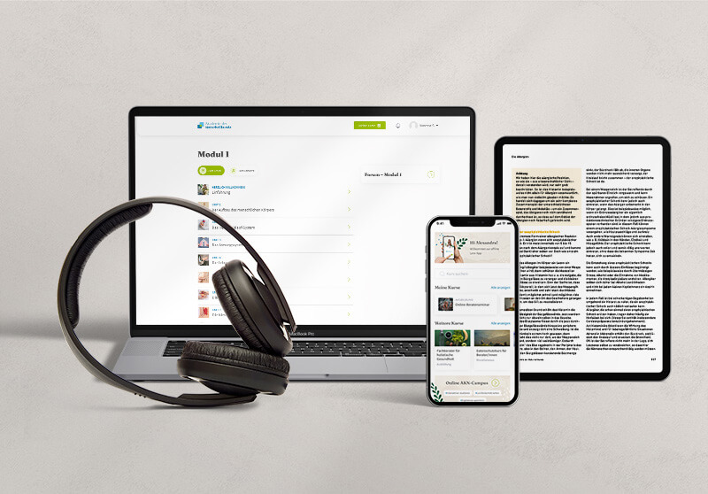 Laptop, Kopfhörer und mobile Endgeräte.