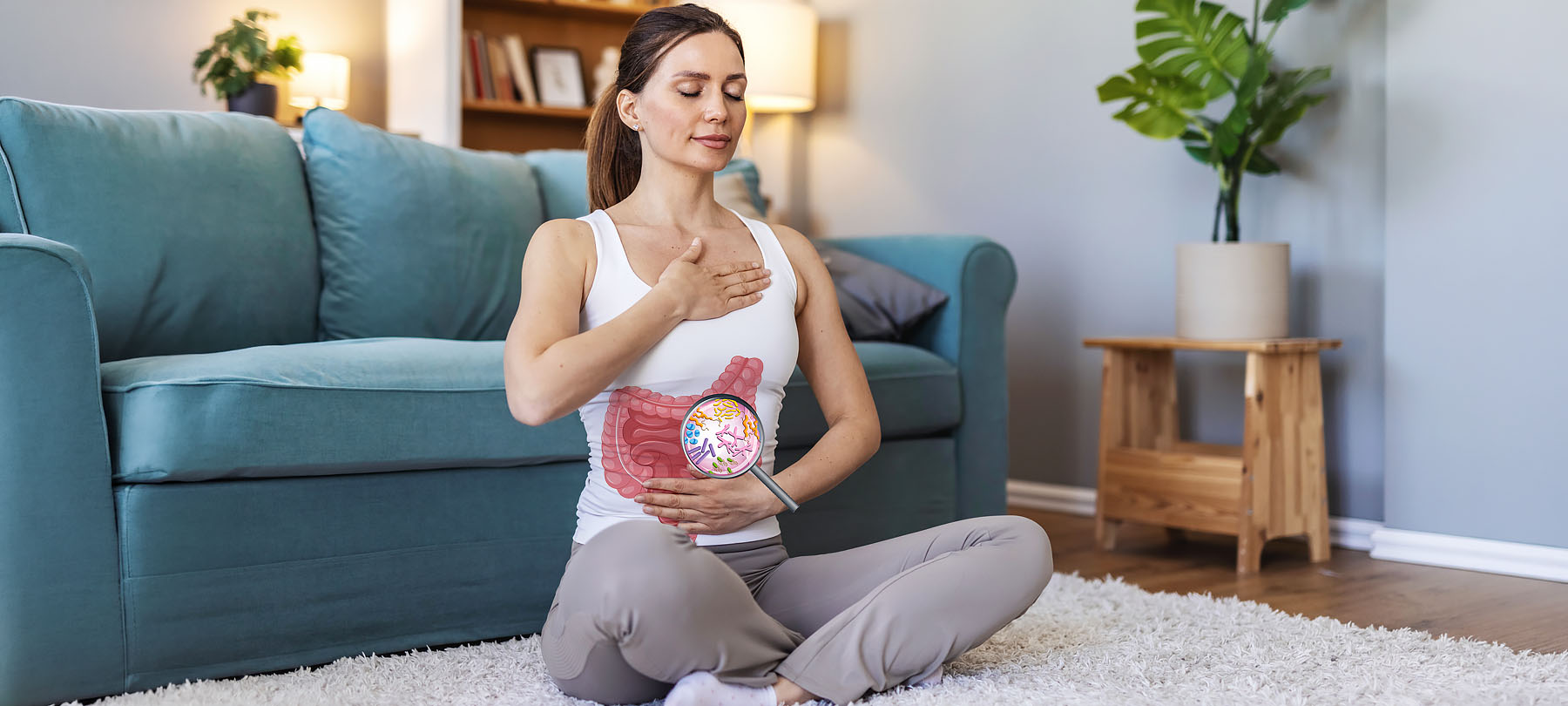 Frau beim meditieren. Der Fokus liegt auf Darmgesundheit.